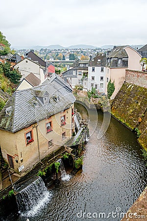River Saar with waterfall and water mills in the historic town of Saarburg, Germany Editorial Stock Photo