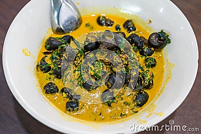 river snail with betel leaves curry Stock Photo