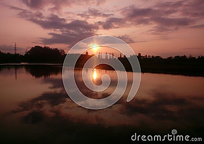 River sunset church clouds shine sun nature Stock Photo