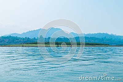 The river is surrounded by forests and mountains. Stock Photo