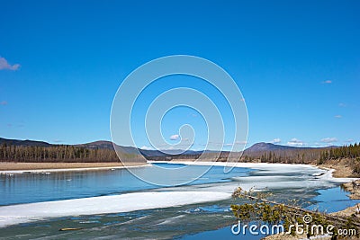 A river thawing in northern british columbia Stock Photo