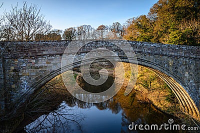 River Till flows beneath Twizel Bridge Stock Photo