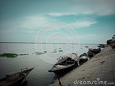 River view with a few fisherman boat landing at the River side. view sunset show the picture full dramatics Stock Photo