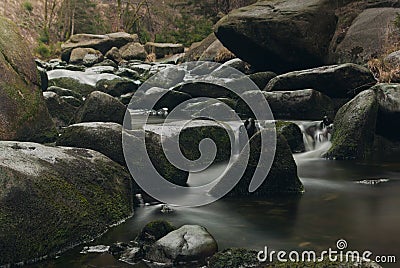 River with mossy Stones, fluent water from a Mountain Stock Photo