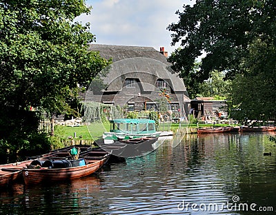 Riverside Thatched Cottage Stock Photo