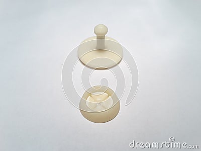 Rivet plastic beige, male and female, on white background Stock Photo