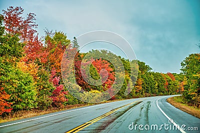 Road across New England countryside in foliage season, USA Stock Photo