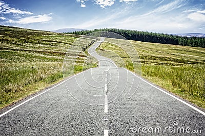 Road ahead disappearing into the distance Stock Photo