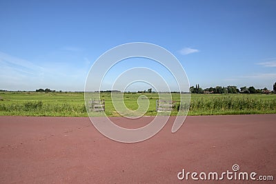 Road Along The Farmlands Of Uiterdam At The Netherlands Stock Photo