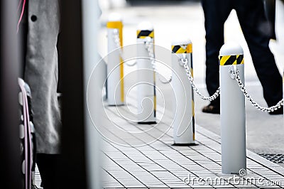 Road block pole in strange line Stock Photo