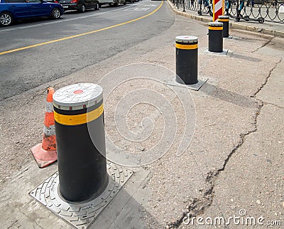 Road blocker in the form of retractable metal poles Editorial Stock Photo