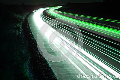 Road with car traffic at night with blurry lights Stock Photo