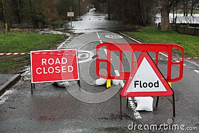 Road closed and flood sign Stock Photo