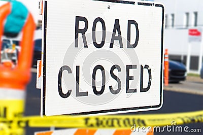 Road closed sign and block in a busy city street. Stock Photo