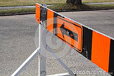 A road closer with arrow construction barrier Stock Photo