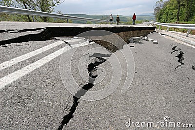 Road collapses with huge cracks. International road collapsed down after bad construction. Damaged Highway Road. Asphalt road. Editorial Stock Photo