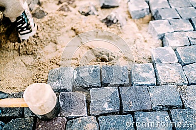 Road construction details. Cobblestone pavement Stock Photo