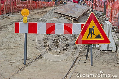 Road construction sign with yellow warning light Stock Photo