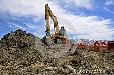 Road construction site with excavating machine Editorial Stock Photo