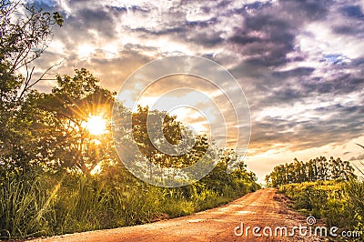 Road in the countryside at sunset, beautiful sunset in the countryside Stock Photo