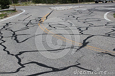 Road cracks repaired by tarmac Stock Photo