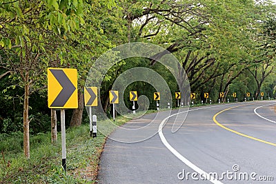 The road curve with street signs reflex light. Stock Photo