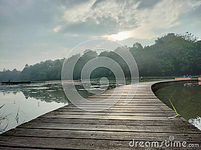 A road that divides a lake in Cibinong Bogor, West Java Stock Photo