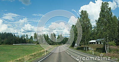 Road in Finland. blue sky and white clouds Stock Photo