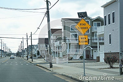 Road Flooded When Flashing sign, Ocean City, New Jersey Stock Photo