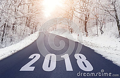 Road in forest in winter with 2018 text Stock Photo