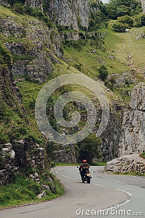 Road going through Cheddar Gorge, Somerset, UK, biker riding through, motion blur Editorial Stock Photo