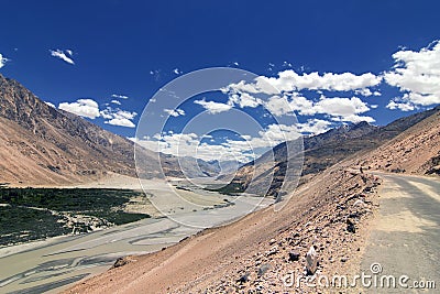 Road through high Himalayan mountains in Ladakh, Jammu and Kashmir, India Stock Photo