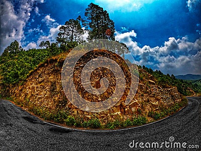 road in indian Himalaya mountain at autumn forest is colorful with folliage of larches Stock Photo