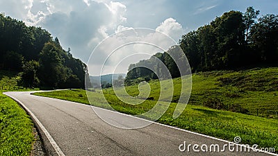 Road leading through landscape Stock Photo