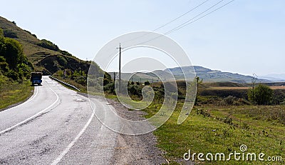 The road leading to the mountains Stock Photo