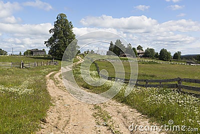 Road leading to the village of the Russian North Stock Photo