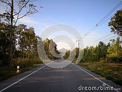 This road leads to the mountain ahead Stock Photo