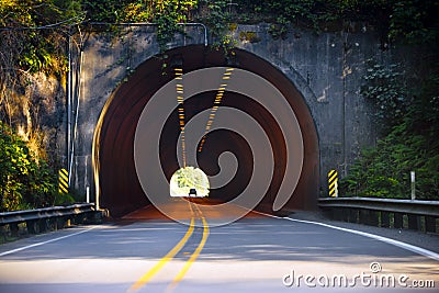 Road and Light at the end of tunnel Stock Photo