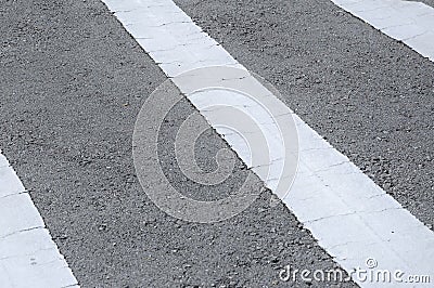 Road line marking made from white thermoplastic material. Stock Photo