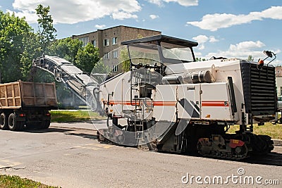 Road machinery repairs the road Stock Photo