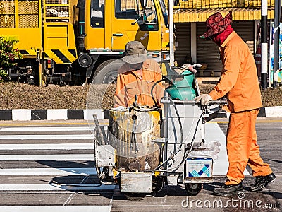 Road Marking Workers at Work. Stock Photo
