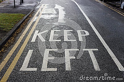 Road markings keep left Stock Photo