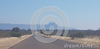 Road; mountain; winter; cars; veld Stock Photo