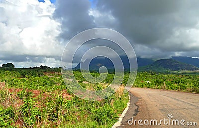 Road in mountains. The cloudy sky. Africa, Mozambique. Stock Photo