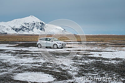 Wonderful nature in winter Iceland. Road in the mountains with the white travel car Editorial Stock Photo