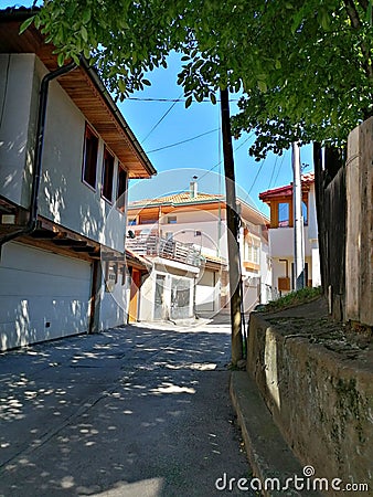 Road in an old town on a sunny day Stock Photo