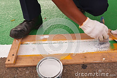 Road painter man worker marking street lines Stock Photo