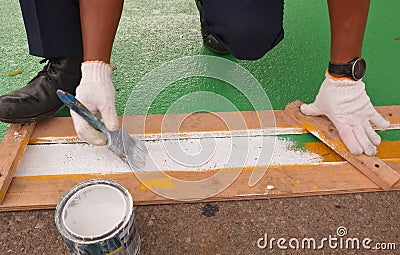 Road painter man worker marking street lines Stock Photo