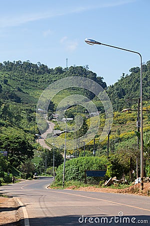 Road pass through Mountain in Countryside Stock Photo