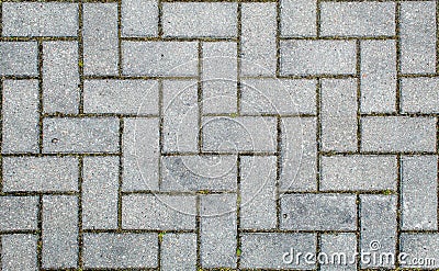 Road paved with sidewalk tiles. texture of light gray bricks Stock Photo